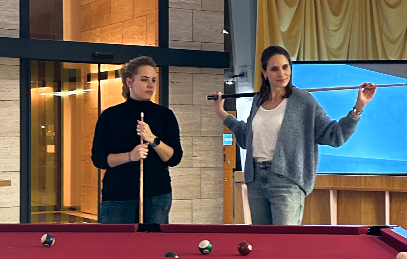 Eleah and Chiara teaming up for a game of pool.
